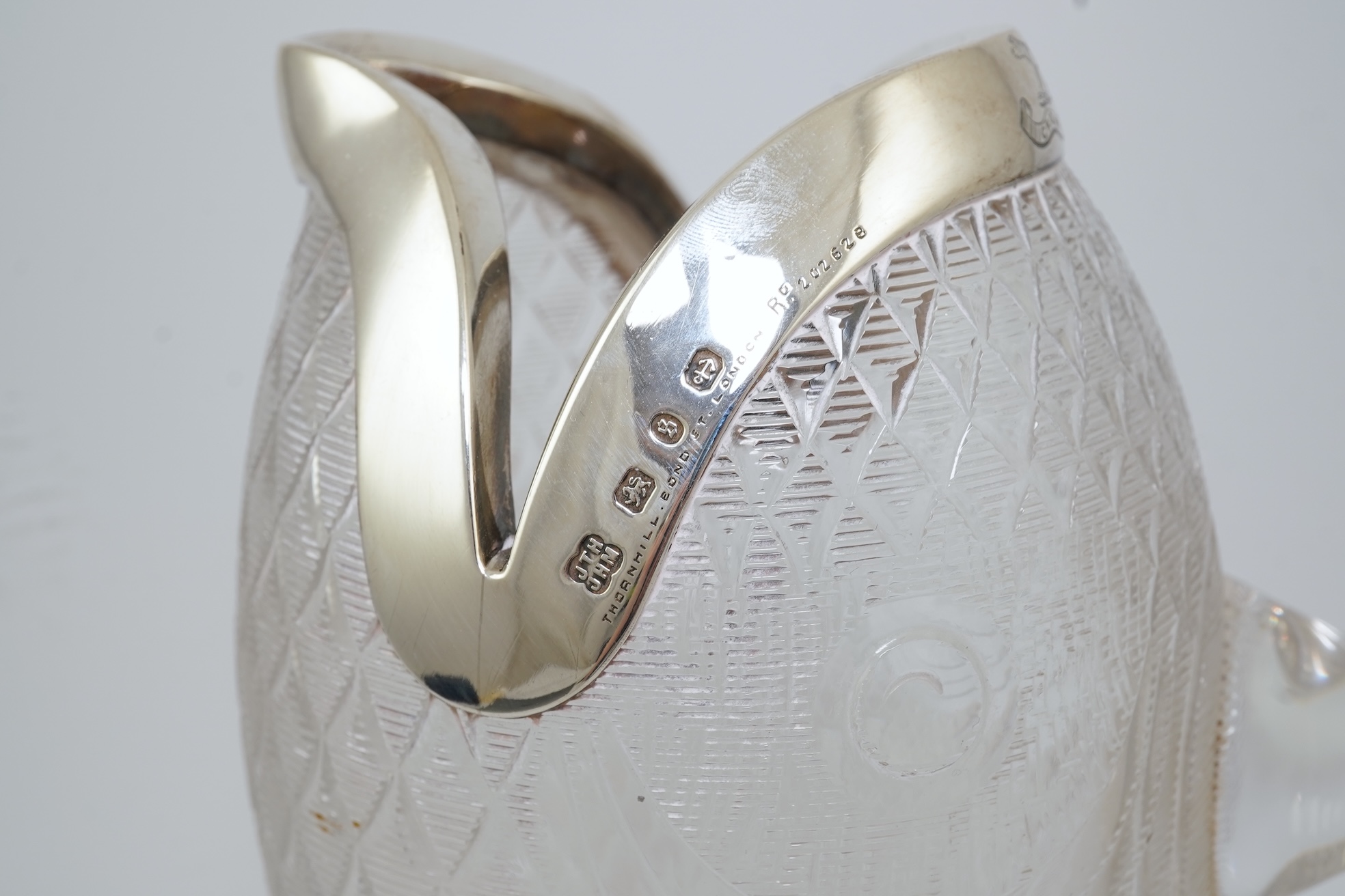 An unusual late Victorian novelty silver mounted single handled cut glass jug, modelled as a fish, by Hukin & Heath